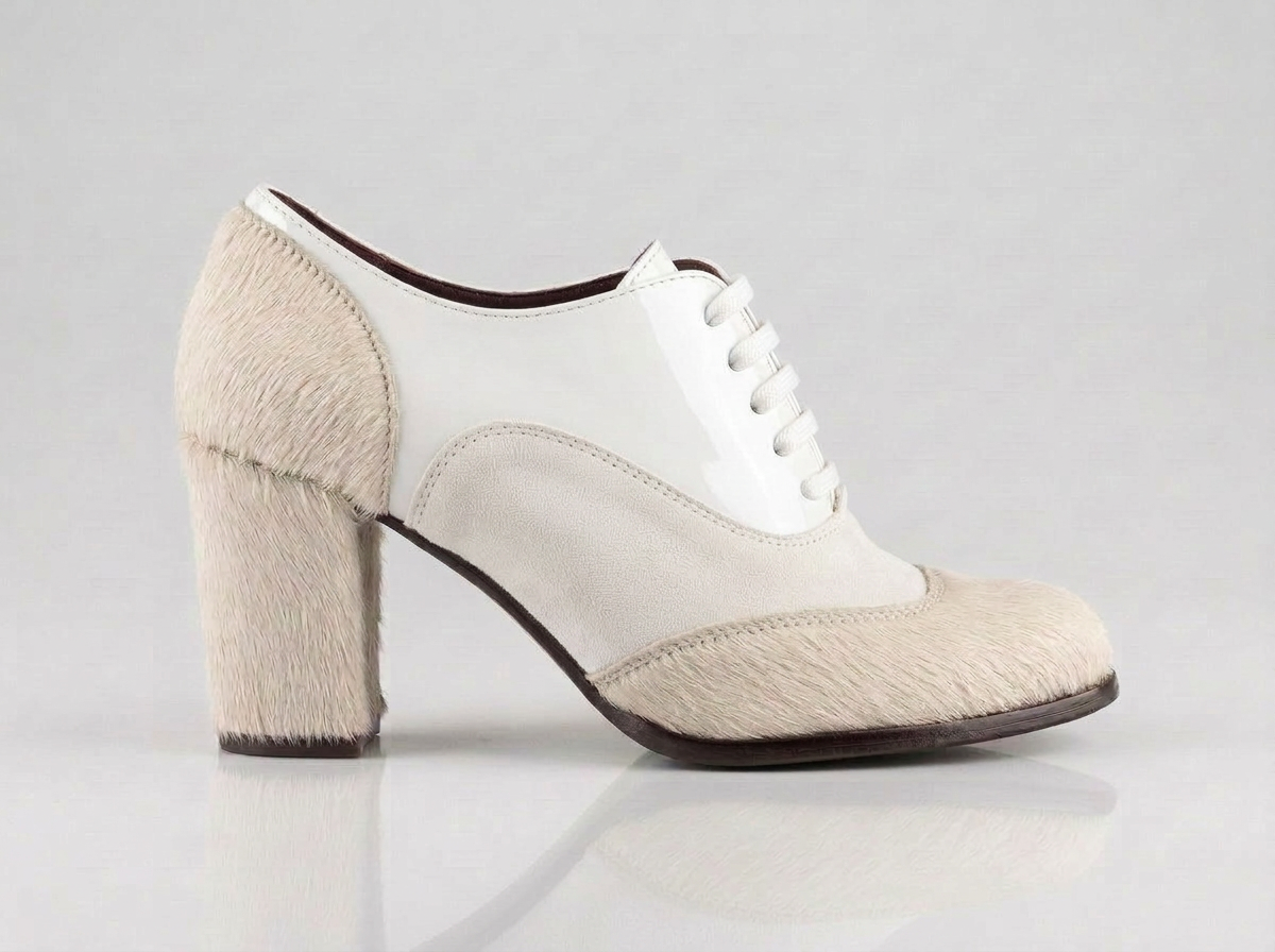 LJUTIKOVA ivory leather Oxford heels with hair-on leather toe and block heel – side view